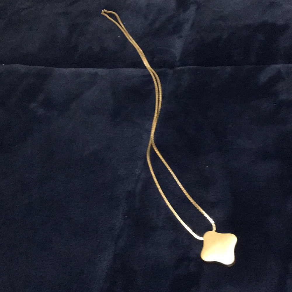 Golden long chain with gold piece at end